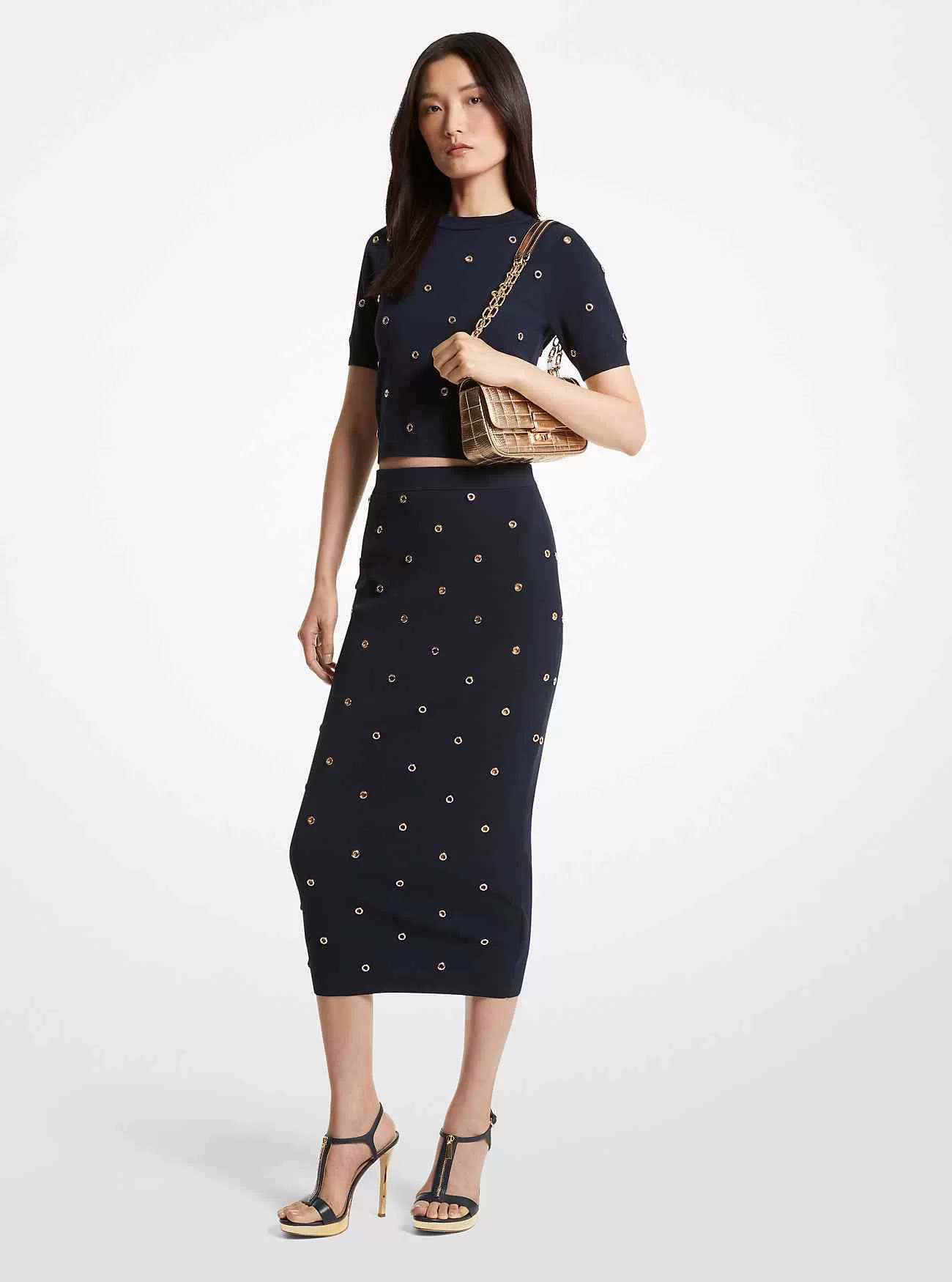 Gonna a tubino in maglia elasticizzata decorata con occhielli